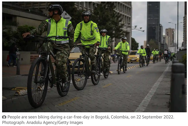 People are seen biking during a car-free-day in Bogotá,